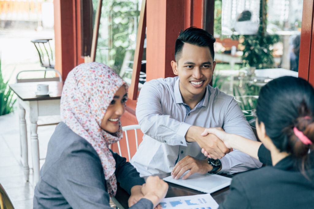 business people shaking hands, finishing up a meeting